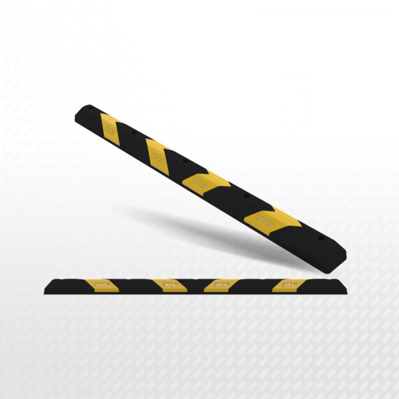 a close-up of a black and yellow road wheel stopper